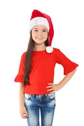 Photo of Cute little child in Santa hat on white background. Christmas celebration