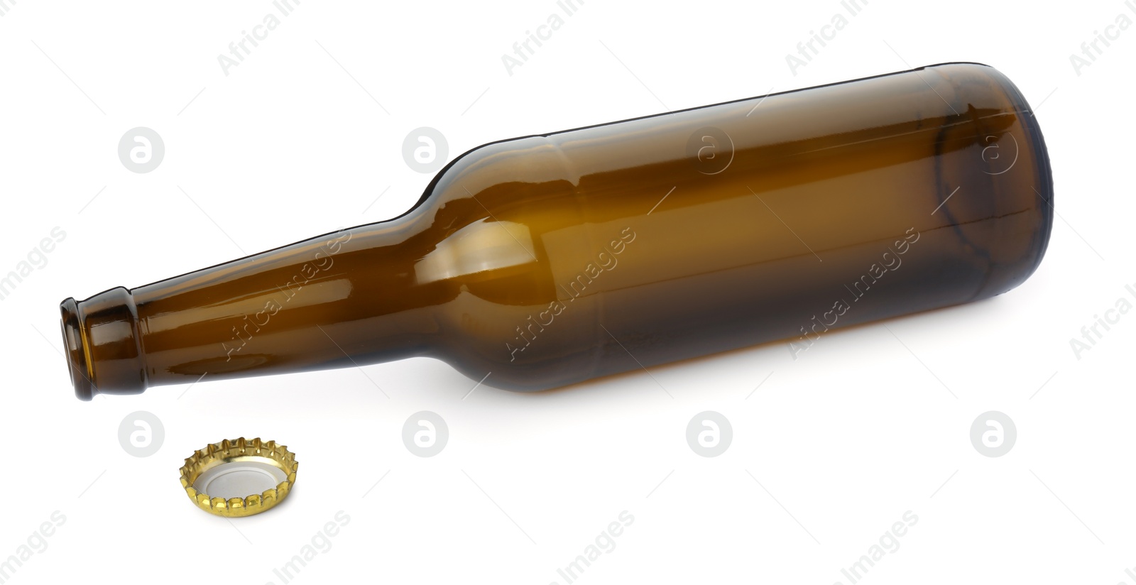 Photo of One empty brown beer bottle and cap isolated on white