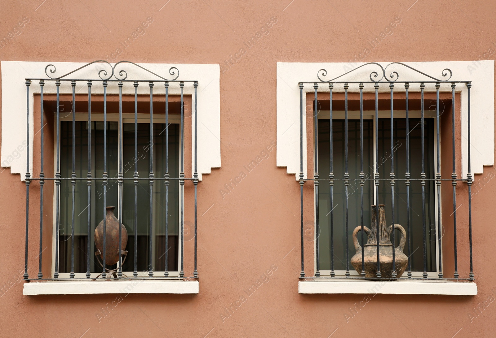 Photo of Building with beautiful windows and steel grilles