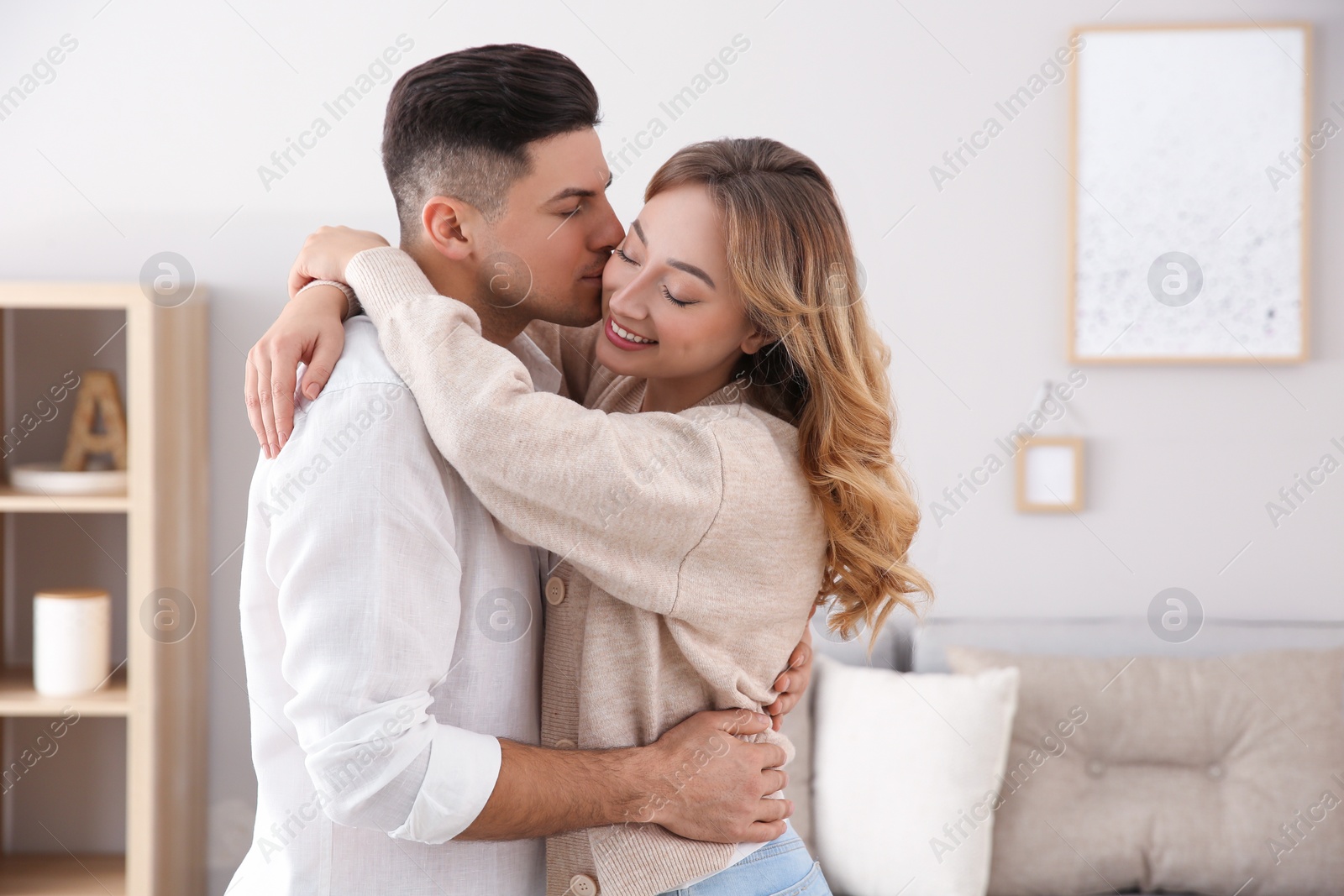 Photo of Lovely couple enjoying time together at home