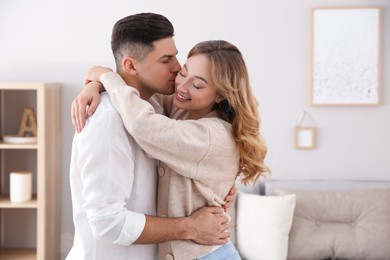 Photo of Lovely couple enjoying time together at home