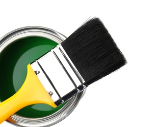 Paint can with brush on white background, top view