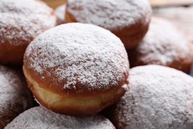 Photo of Delicious sweet buns with powdered sugar as background, closeup