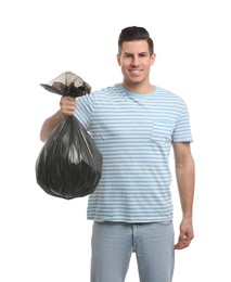 Man holding full garbage bag on white background