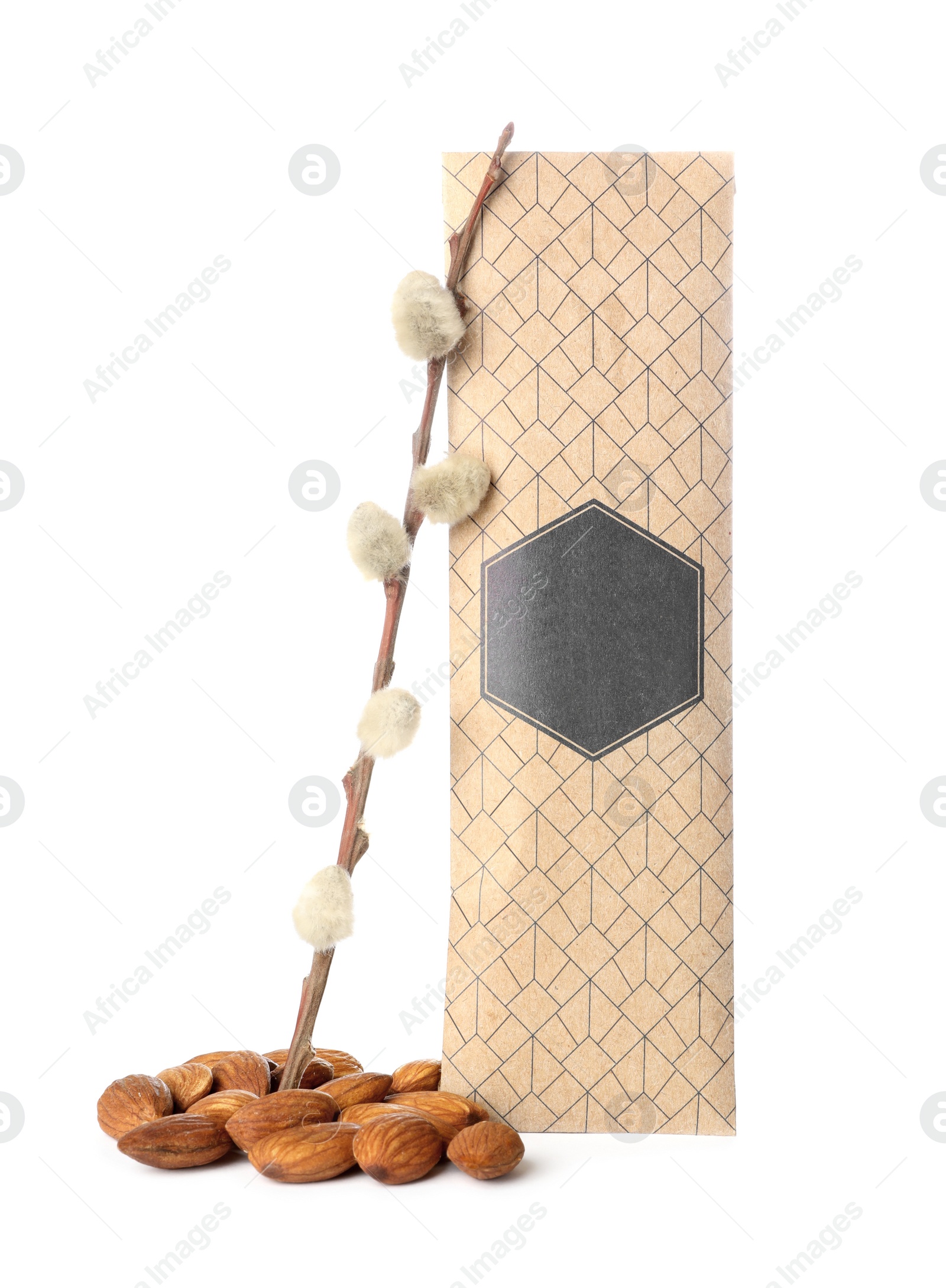 Photo of Scented sachet, pussy willow branch and almonds on white background