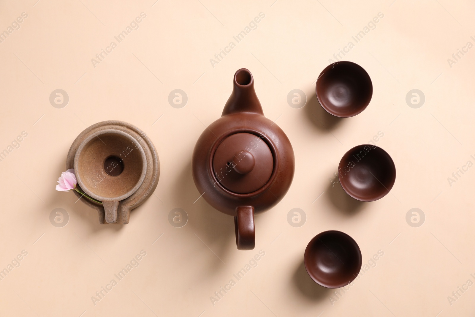 Photo of Beautiful set for traditional tea ceremony on beige background, flat lay