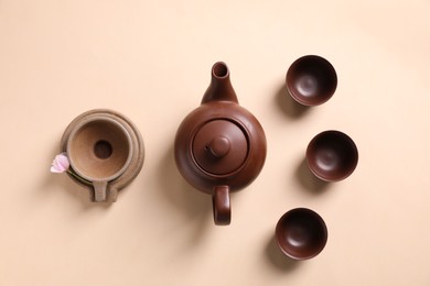 Beautiful set for traditional tea ceremony on beige background, flat lay