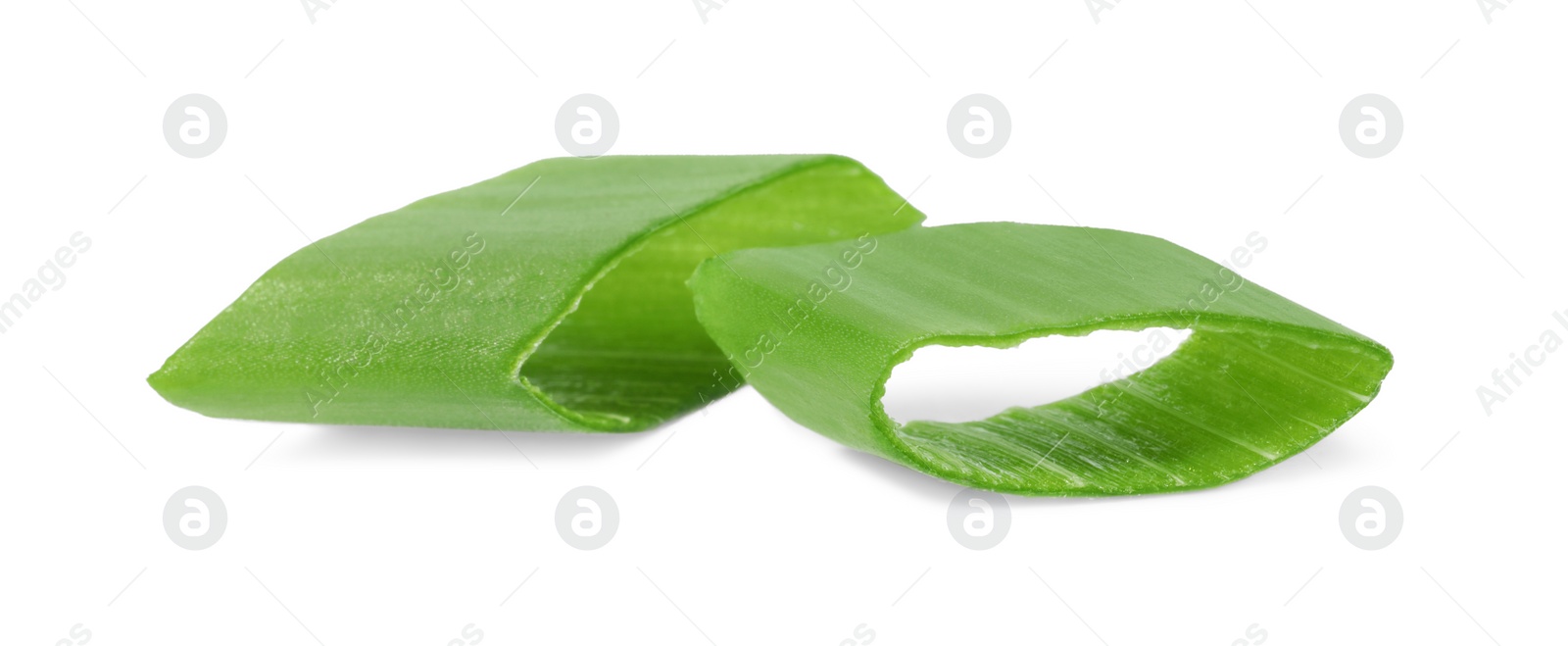 Photo of Pieces of fresh green onion isolated on white