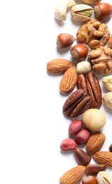 Photo of Mixed organic nuts on white background, top view