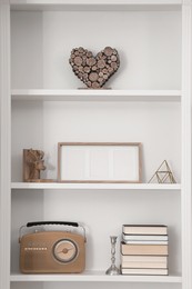 Stylish shelves with different decor elements. Interior design