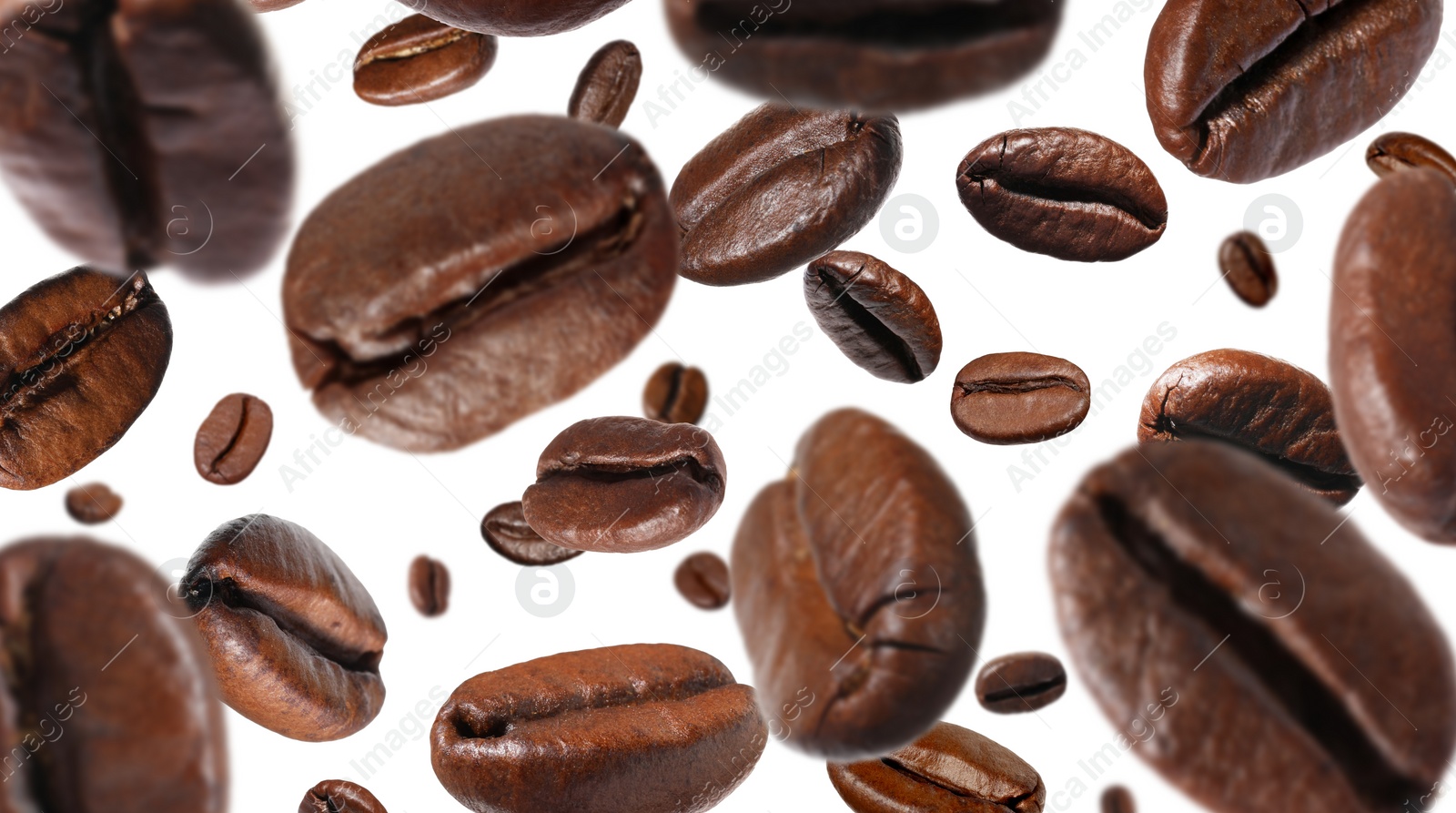 Image of Roasted coffee beans falling o white background