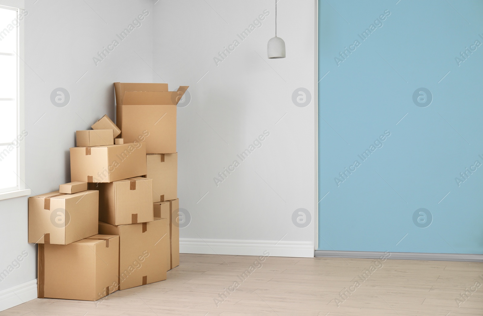 Photo of Cardboard boxes on floor indoors