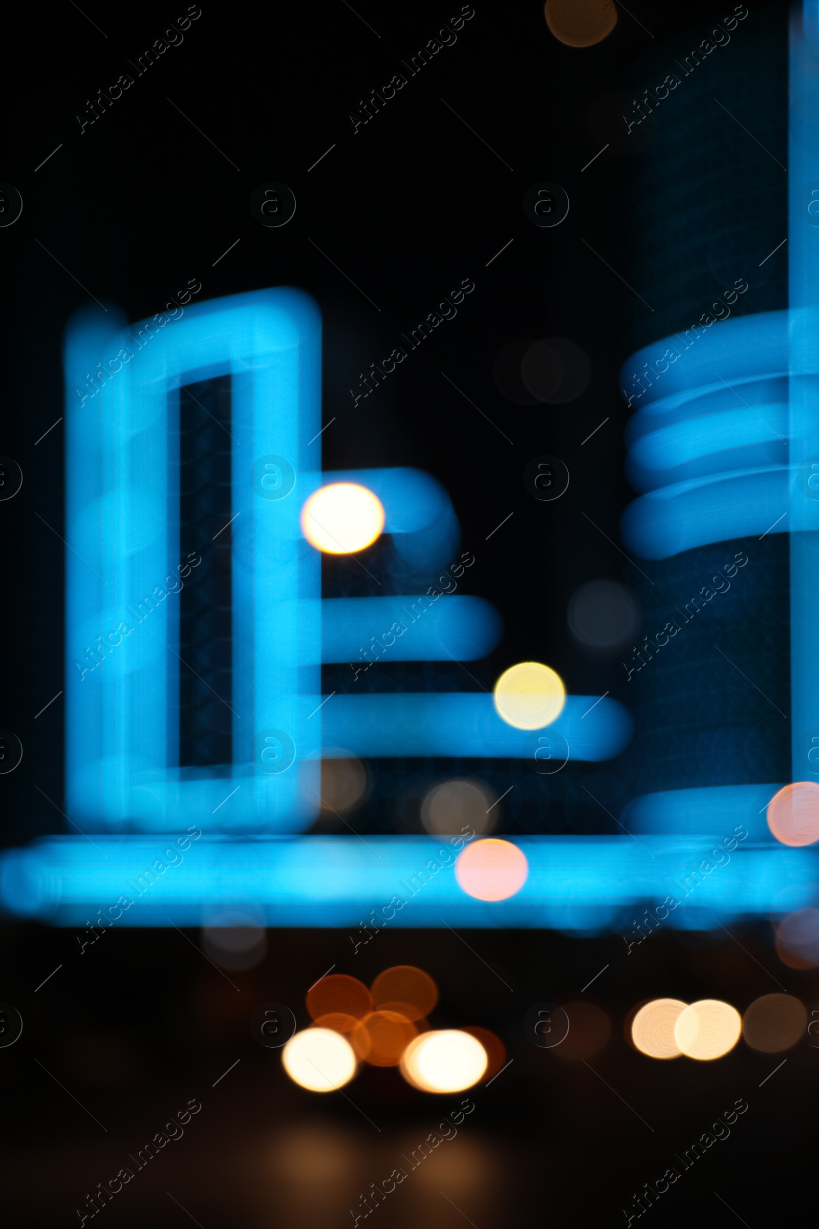 Photo of Blurred view of cityscape with bokeh effect. Night life