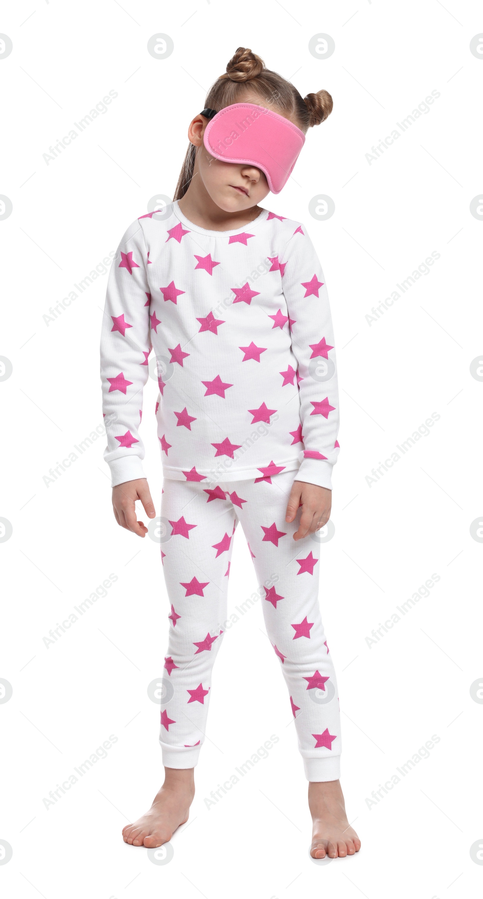 Photo of Girl in pajamas and sleep mask sleepwalking on white background