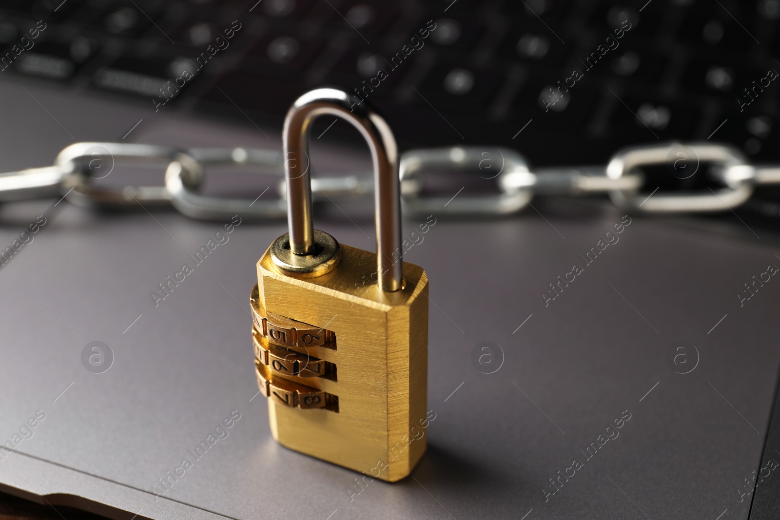 Photo of Cyber security. Padlock on laptop, closeup view