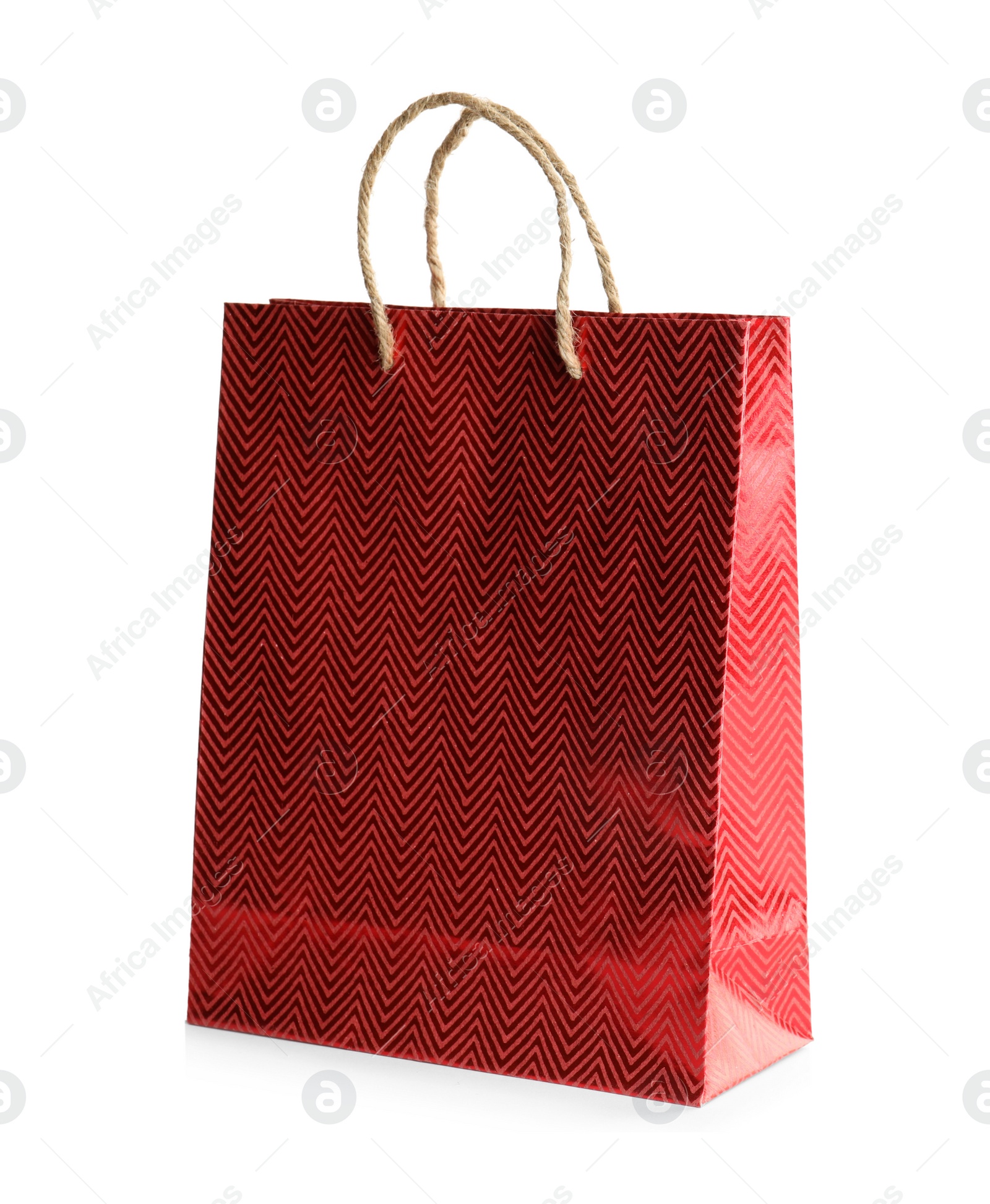 Photo of Red paper shopping bag isolated on white. Space for design