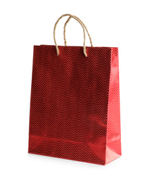 Photo of Red paper shopping bag isolated on white. Space for design