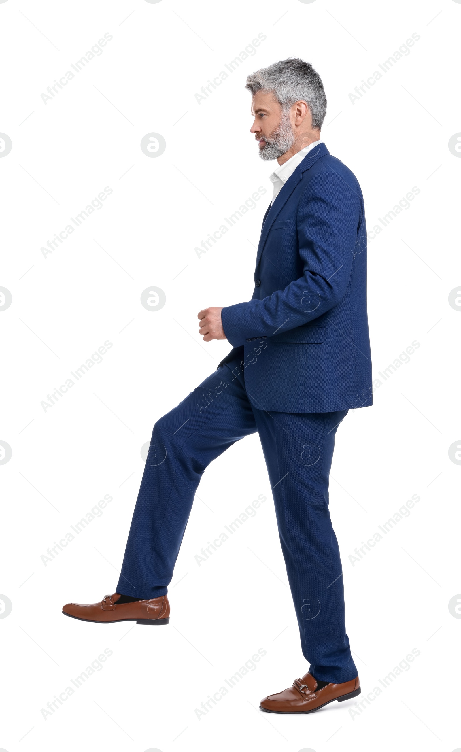 Photo of Mature businessman in stylish clothes posing on white background