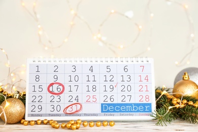 Photo of Calendar and decor on table. Christmas countdown