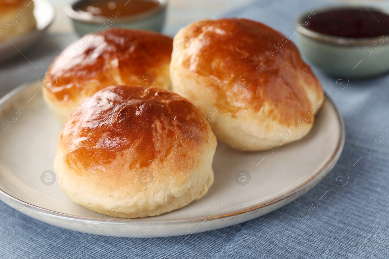 Photo of Tasty scones prepared on soda water on table, closeup