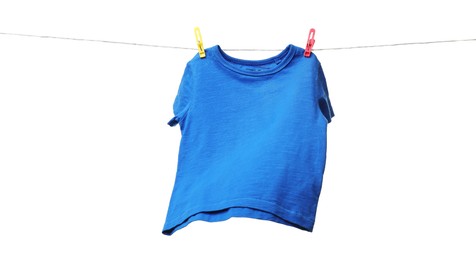 One blue t-shirt drying on washing line isolated on white