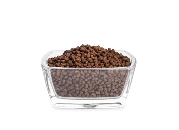 Buckwheat tea granules in glass bowl on white background