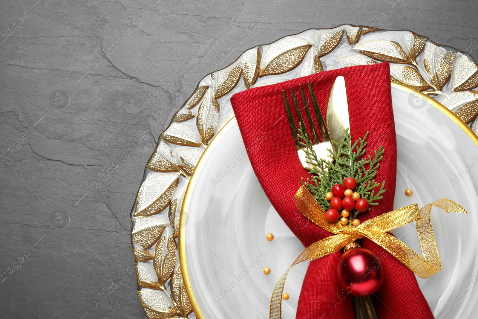 Photo of Beautiful Christmas table setting on grey background, top view