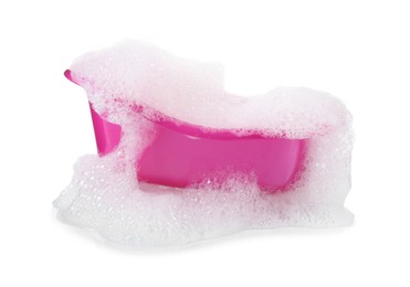 Photo of Pink toy bathtub with foam isolated on white