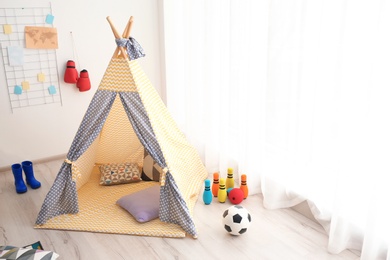 Photo of Play tent for child in modern room