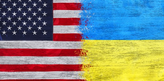 Image of National flags of Ukraine and USA symbolizing partnership between countries. Banner design