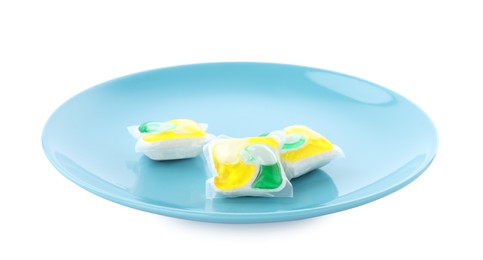 Photo of Light blue plate with dishwasher detergent pods on white background