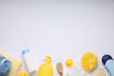 Photo of Different baby bath accessories and cosmetic products on white background, flat lay. Space for text