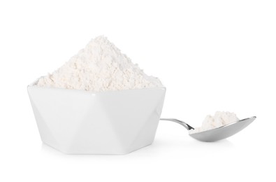 Photo of Bowl and spoon with flour on white background