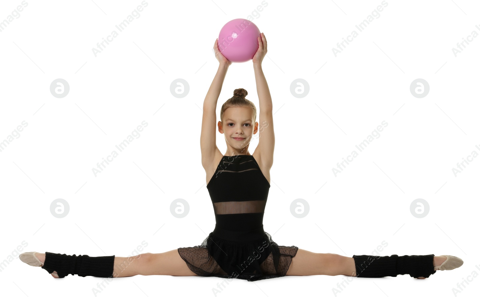 Photo of Cute little gymnast with sitting on side split against white background