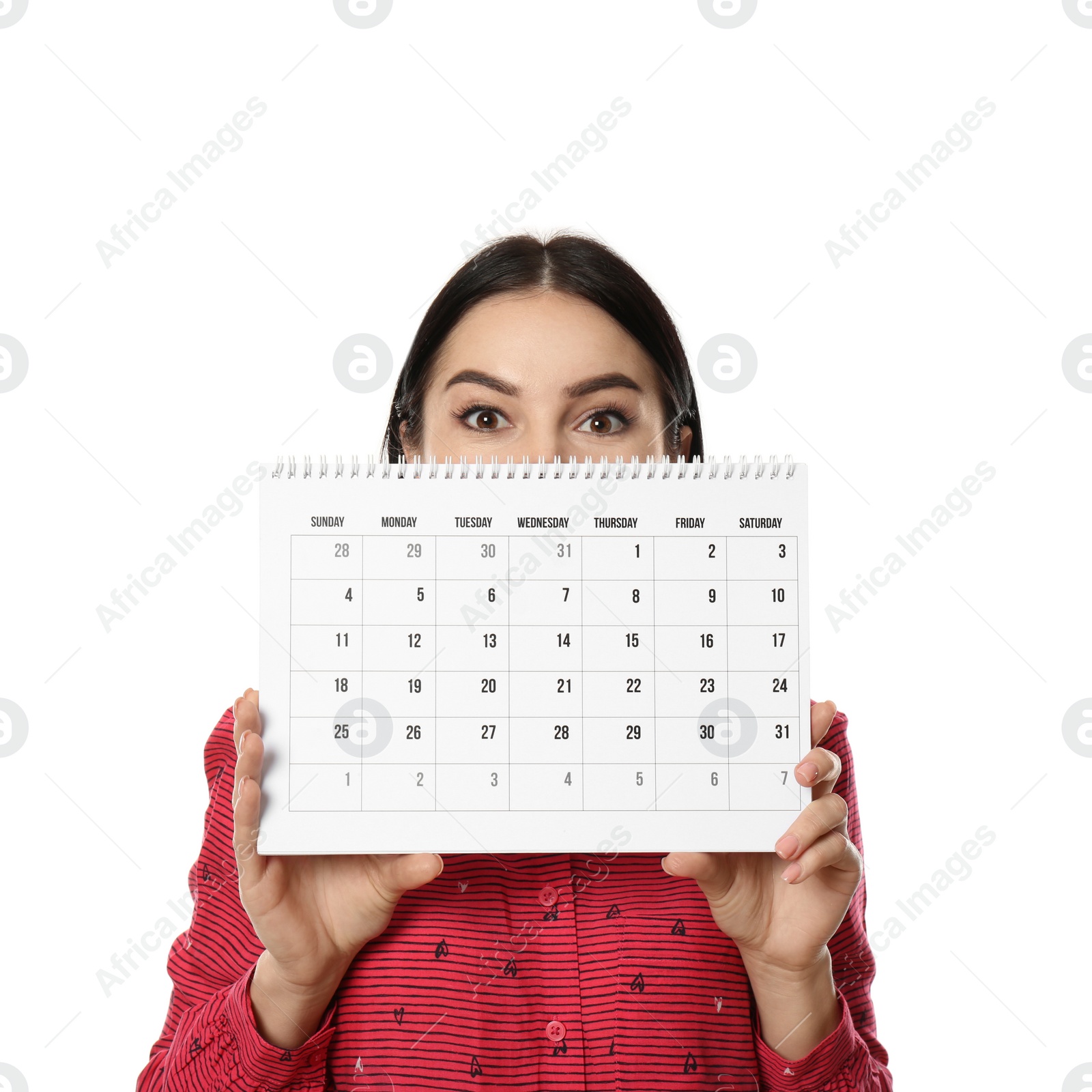 Photo of Young woman holding calendar with marked menstrual cycle days on white background