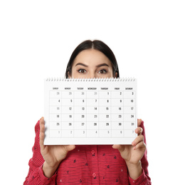 Young woman holding calendar with marked menstrual cycle days on white background