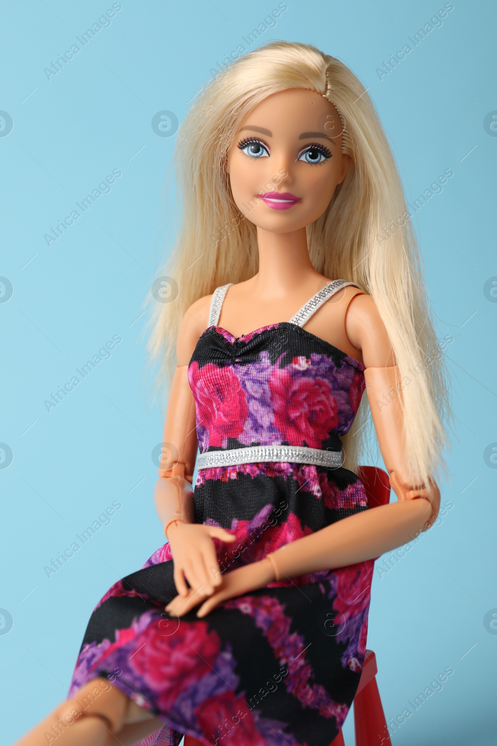 Photo of Mykolaiv, Ukraine - September 4, 2023: Beautiful Barbie doll on light blue background