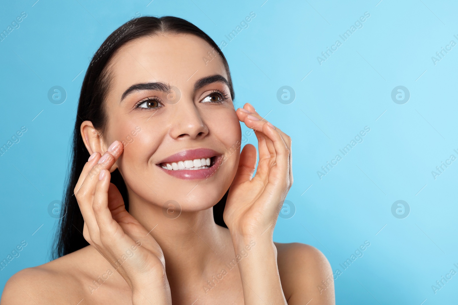Photo of Portrait of attractive young woman on light blue background, space for text. Spa treatment