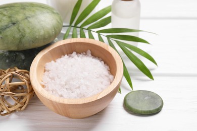 Photo of Beautiful spa composition with sea salt on white wooden table