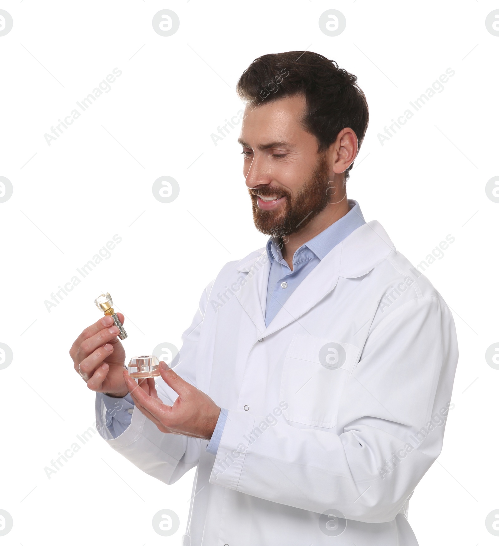 Photo of Dentist holding educational model of dental implant on white background