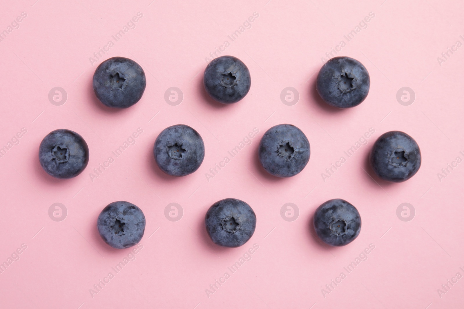 Photo of Flat lay composition with tasty blueberry on color background