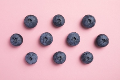 Flat lay composition with tasty blueberry on color background