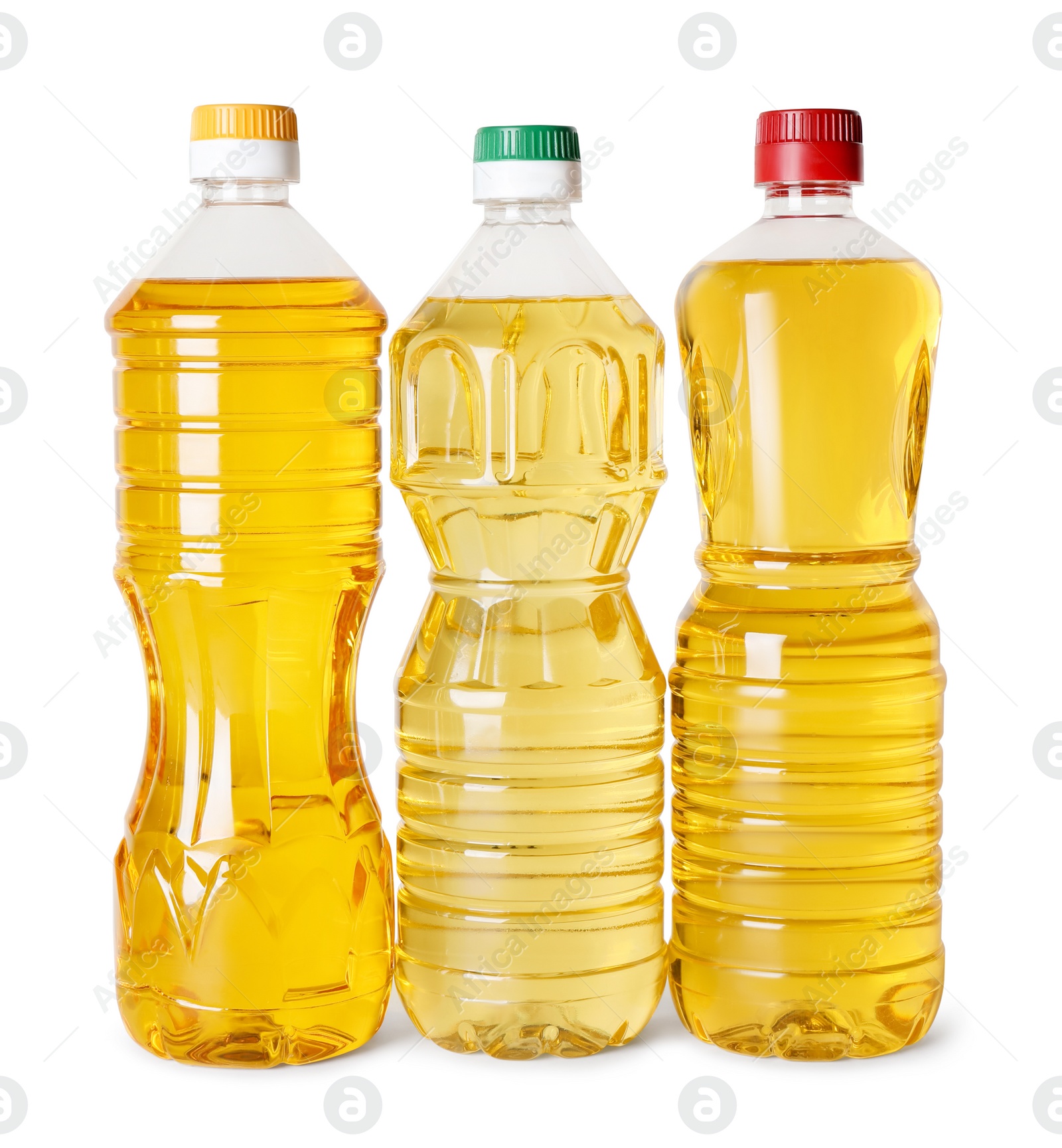 Photo of Bottles of cooking oil on white background