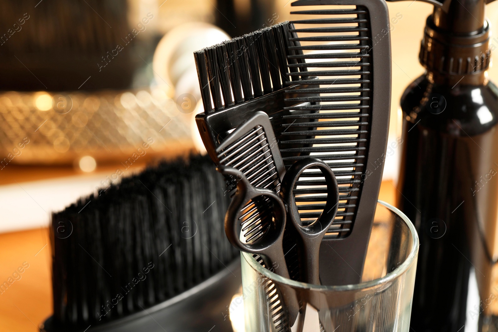 Photo of Set of hairdresser tools in salon, closeup