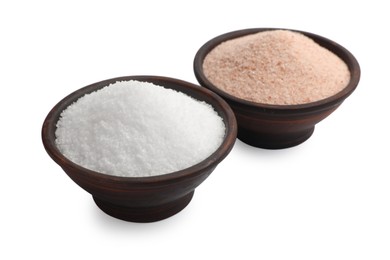 Photo of Different types of natural salt in bowls isolated on white