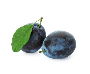 Photo of Delicious fresh ripe plums on white background