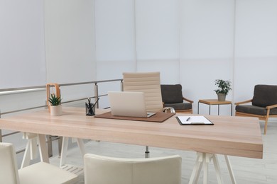 Photo of Modern medical office interior with doctor's workplace