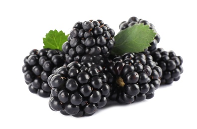 Tasty ripe blackberries and leaves on white background