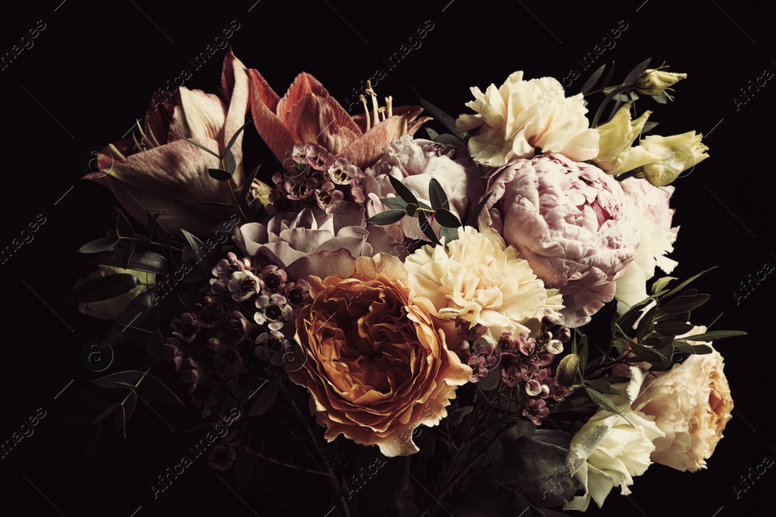 Photo of Beautiful bouquet of different flowers on black background. Floral card design with dark vintage effect