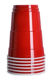 Photo of Many red plastic cups on white background